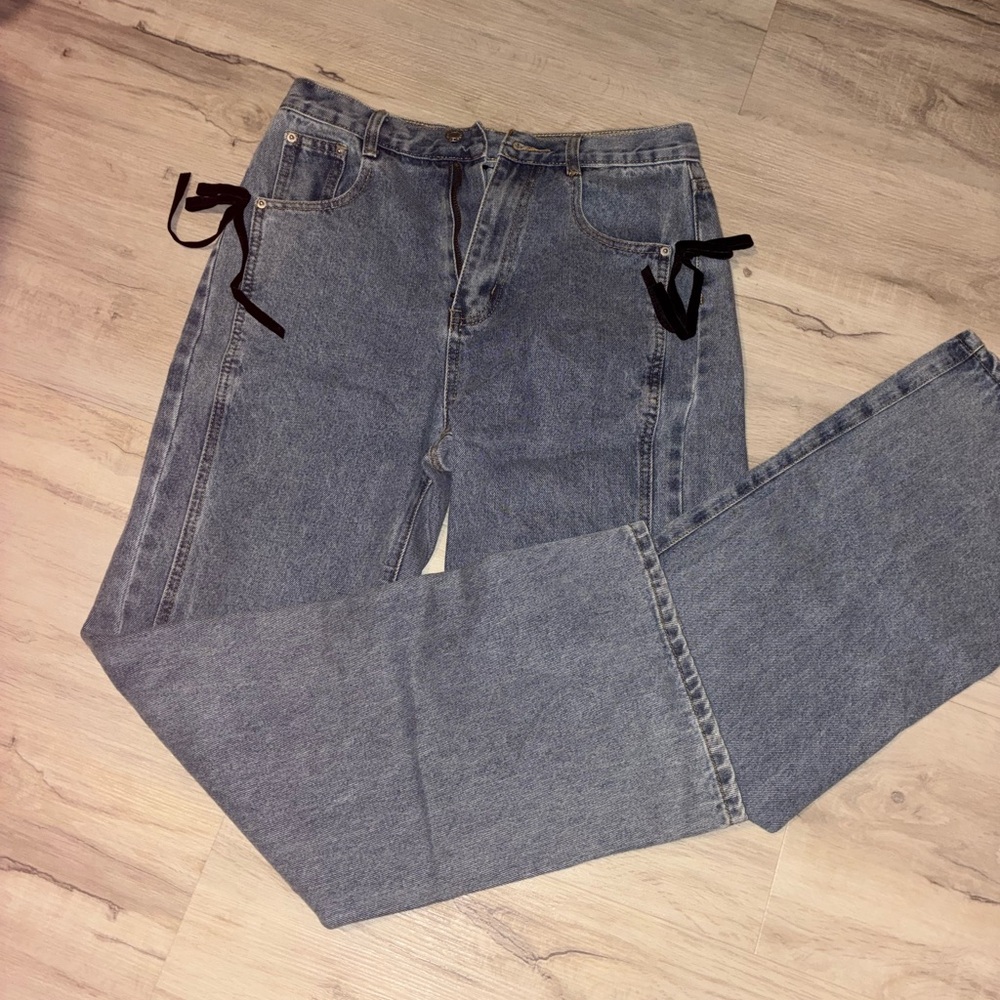 Stylish Blue Jeans with Black Bow Accents